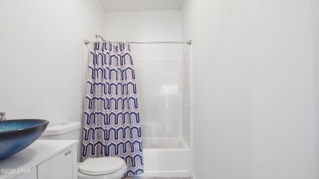 full bath with vanity, toilet, and shower / bath combo with shower curtain