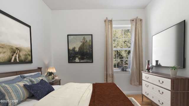 bedroom with wood finished floors
