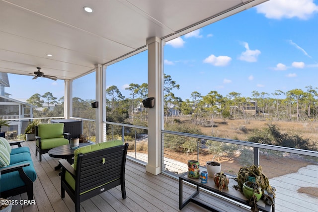 wooden terrace featuring an outdoor hangout area and ceiling fan