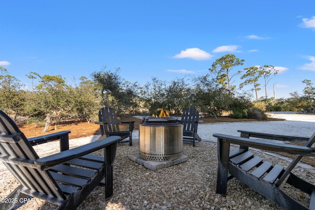 view of community featuring an outdoor fire pit