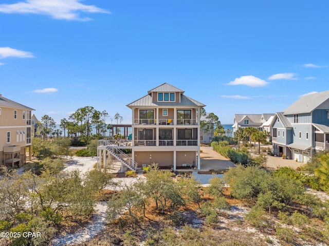 rear view of property with a sunroom