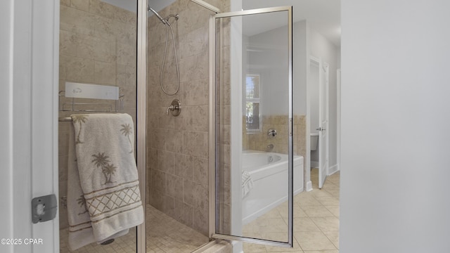 bathroom with separate shower and tub and tile patterned floors