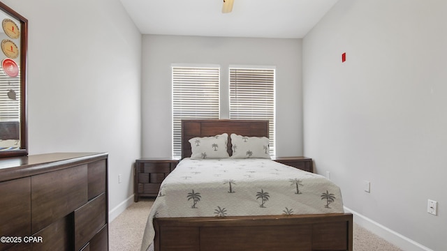 bedroom with ceiling fan and light colored carpet