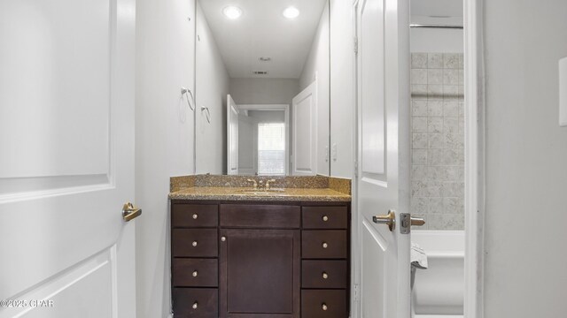 unfurnished bedroom with light colored carpet and a closet