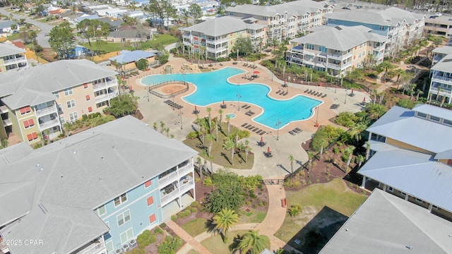 view of pool with a hot tub