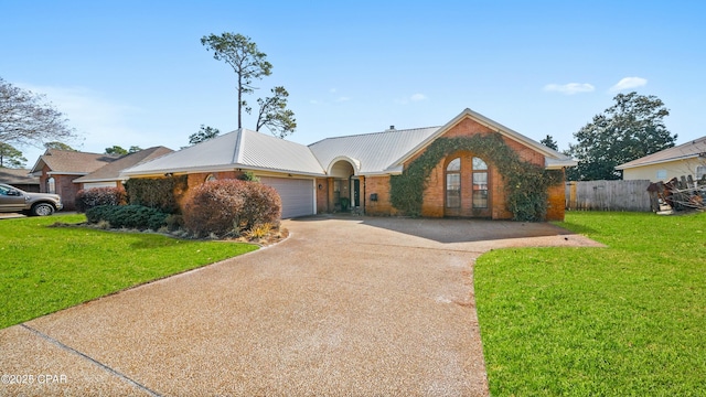 ranch-style home featuring a garage and a front lawn