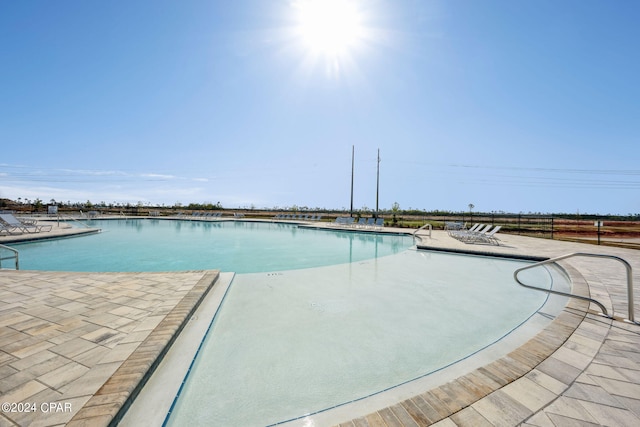 view of swimming pool featuring a patio area