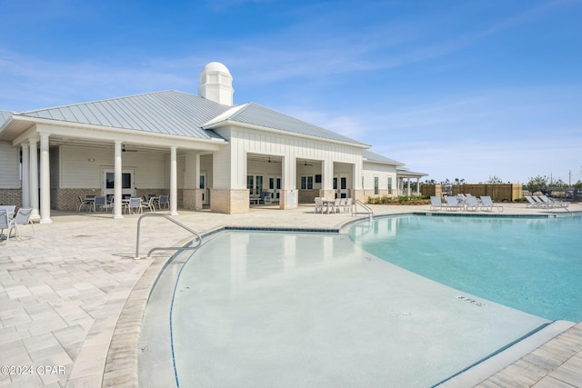 view of pool featuring ceiling fan and a patio area