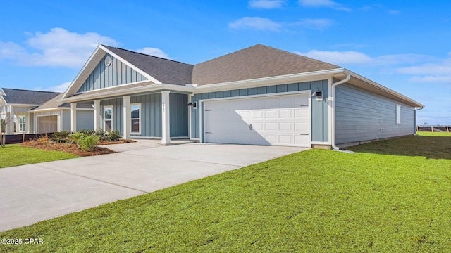 view of front of property with a garage and a front lawn