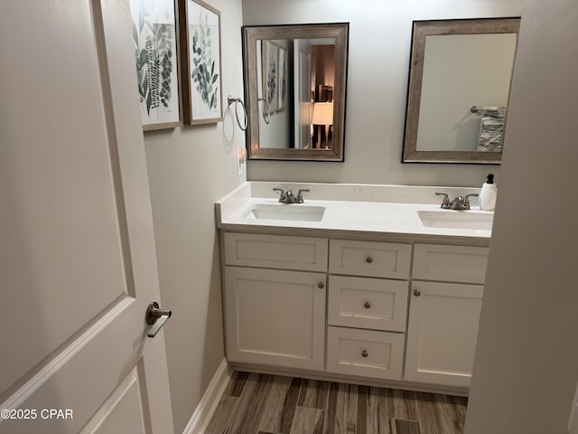 bathroom featuring hardwood / wood-style flooring and vanity