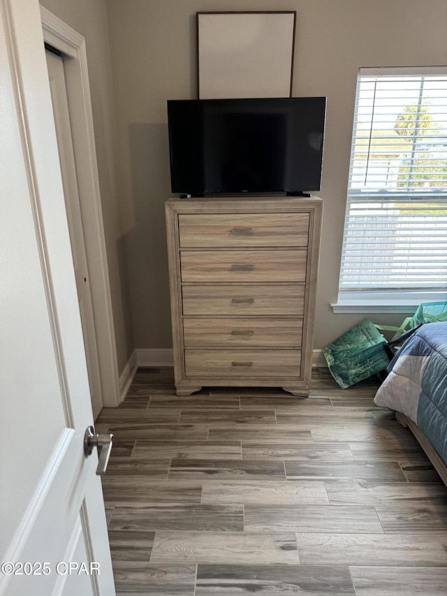 bedroom featuring multiple windows