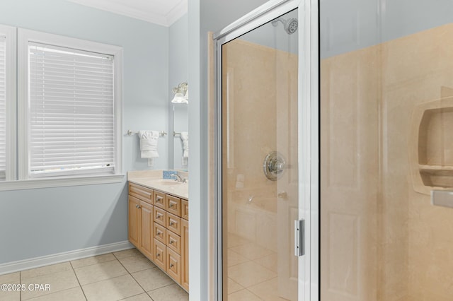 full bathroom with tile patterned floors, a shower stall, ornamental molding, and vanity