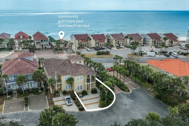 bird's eye view featuring a water view and a residential view