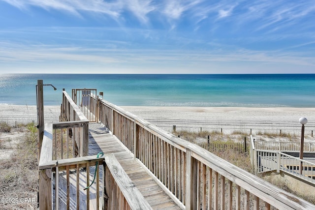 view of home's community featuring a view of the beach and a water view