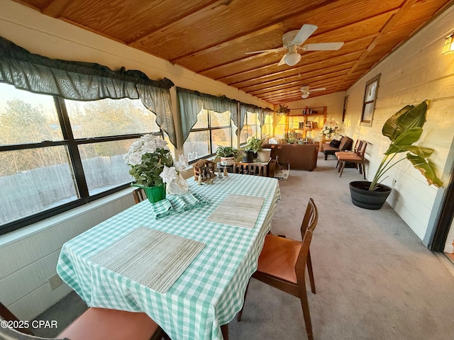 sunroom with ceiling fan, wooden ceiling, and vaulted ceiling