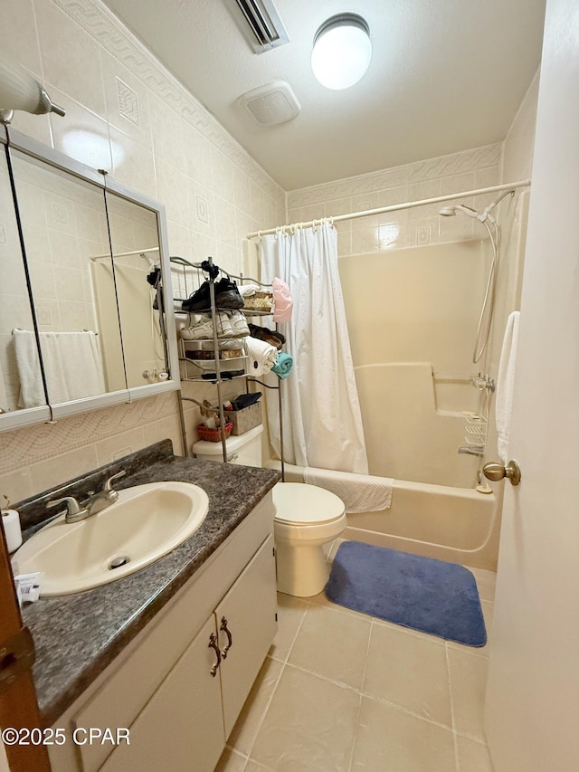 full bathroom featuring visible vents, shower / tub combo with curtain, decorative backsplash, tile patterned floors, and tile walls