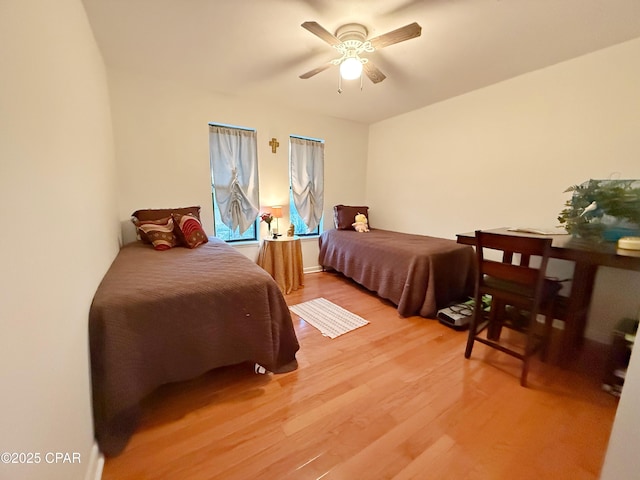 bedroom featuring a ceiling fan and light wood finished floors