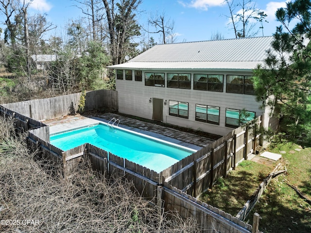 view of swimming pool with a fenced in pool and a fenced backyard