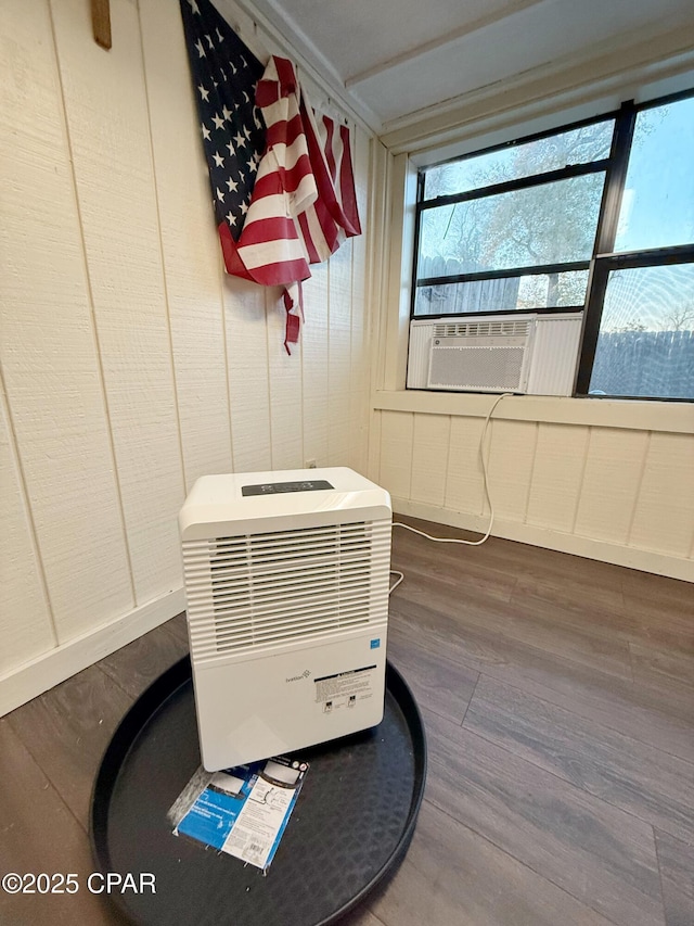 details featuring heating unit, wood finished floors, and cooling unit