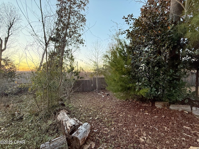 yard at dusk with fence