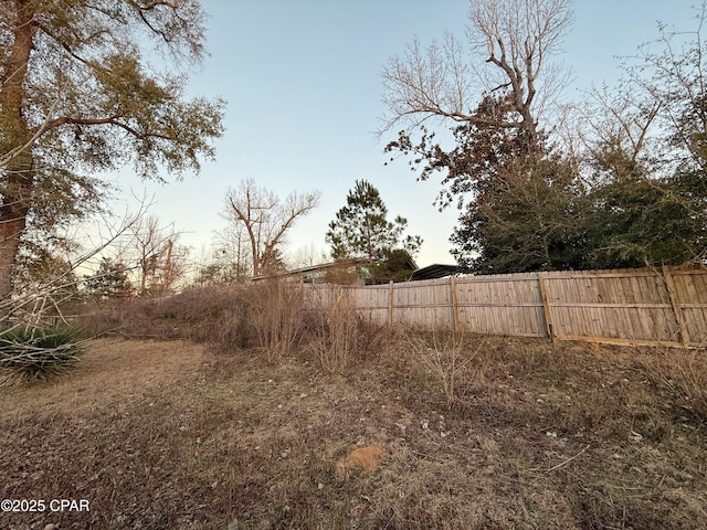 view of yard with fence