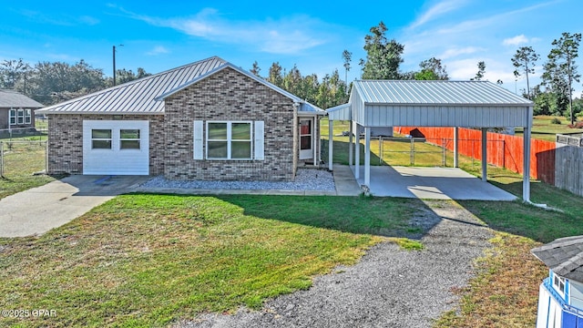 view of front facade with a carport and a front yard