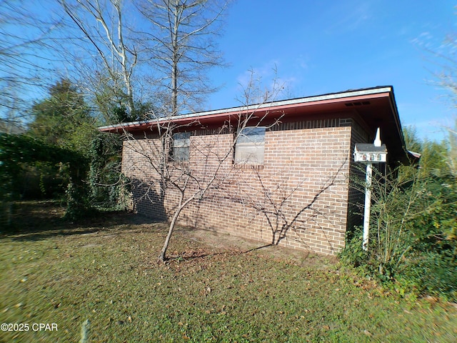 view of home's exterior featuring a yard