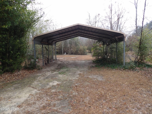 view of parking / parking lot with a carport