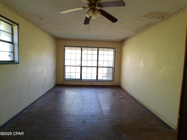 empty room with a healthy amount of sunlight and ceiling fan