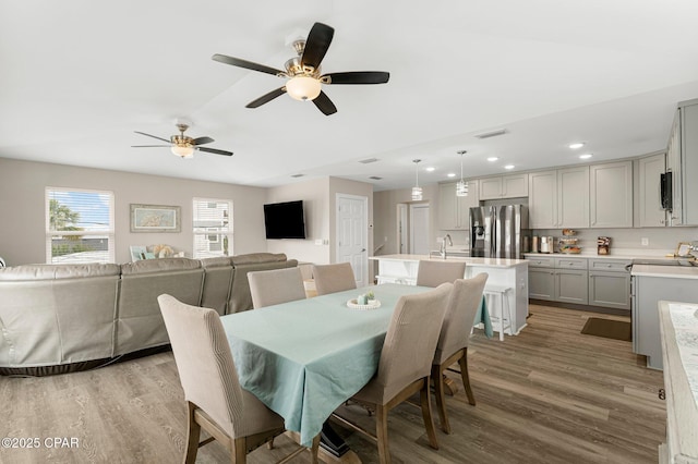 dining room featuring recessed lighting, visible vents, and wood finished floors