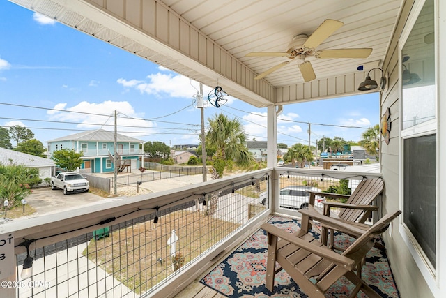 balcony with a sunroom and a ceiling fan