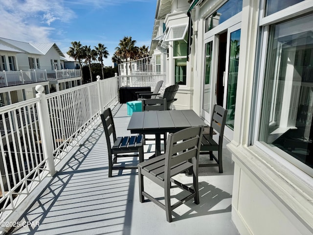 view of patio / terrace with outdoor dining space and a balcony