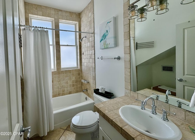 full bathroom featuring vanity, visible vents, tile patterned flooring, shower / bath combination with curtain, and toilet