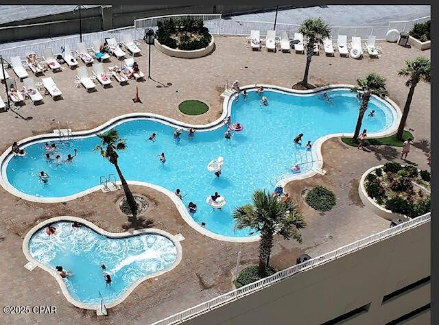 view of swimming pool featuring a patio area