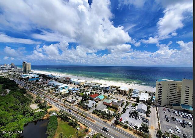 aerial view featuring a water view and a view of the beach