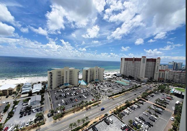 bird's eye view with a water view and a beach view