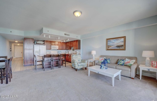 living room featuring light carpet