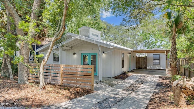 506 Le Grand Dr, Panama City Beach, FL 32413 - view of front of house featuring french doors