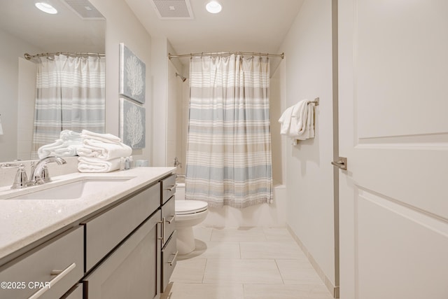 full bathroom with vanity, shower / bathtub combination with curtain, tile patterned floors, and toilet