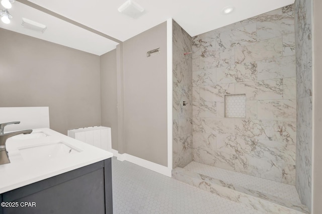 bathroom featuring tiled shower, vanity, and radiator heating unit