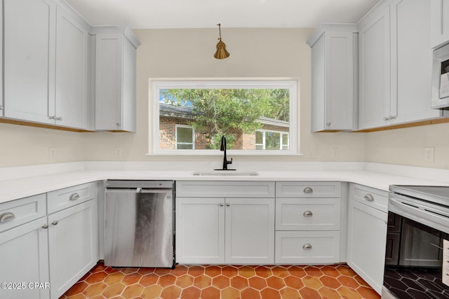 kitchen featuring white cabinetry, appliances with stainless steel finishes, and sink