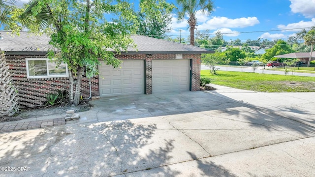 garage featuring a yard