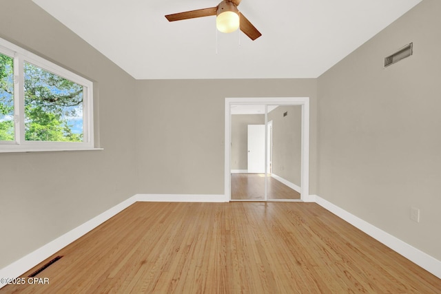 unfurnished room featuring ceiling fan and light hardwood / wood-style floors