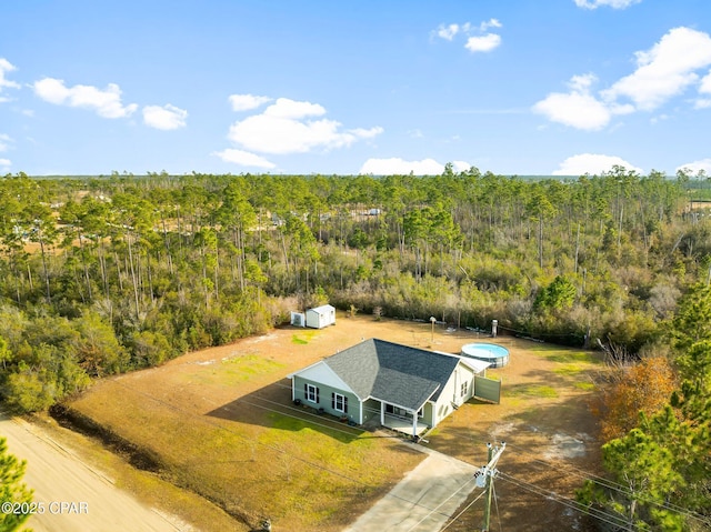 bird's eye view featuring a view of trees