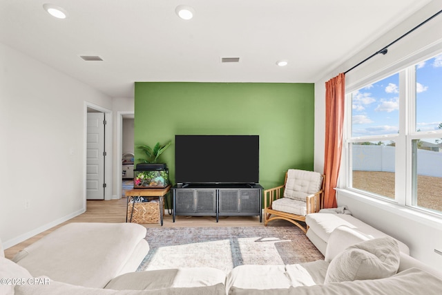 living room with light hardwood / wood-style floors