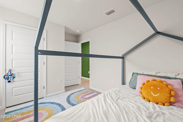 bedroom with light colored carpet