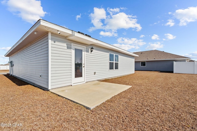 rear view of property featuring a patio