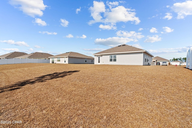 back of property with a yard