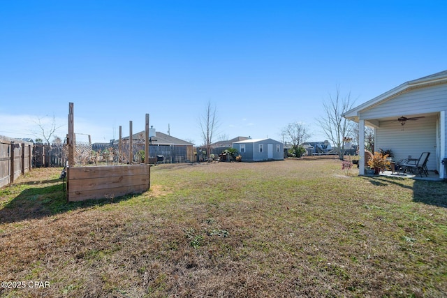 view of yard with ceiling fan