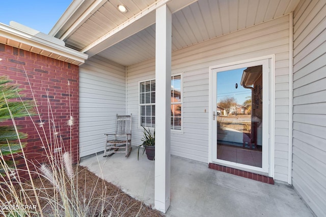 property entrance with a patio area